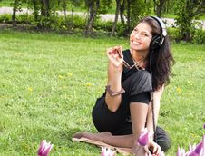 Smiling Pretty Brunette Sits On The Grass Stock Image Smiling Pretty Brunette Sits On The Grass Stock Image