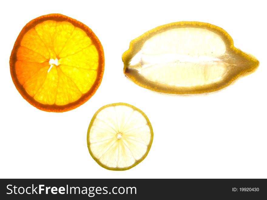 Slices of Orange, Lemon and Lime isolated on a white background. Slices of Orange, Lemon and Lime isolated on a white background.