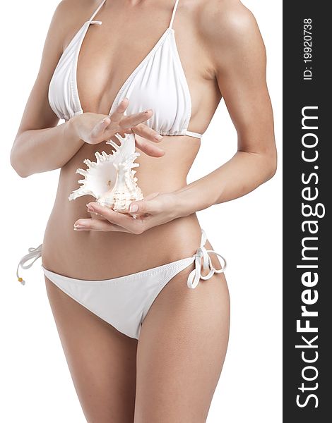 Beautiful woman in white bikini holding shell, seashell. Beautiful woman in white bikini holding shell, seashell