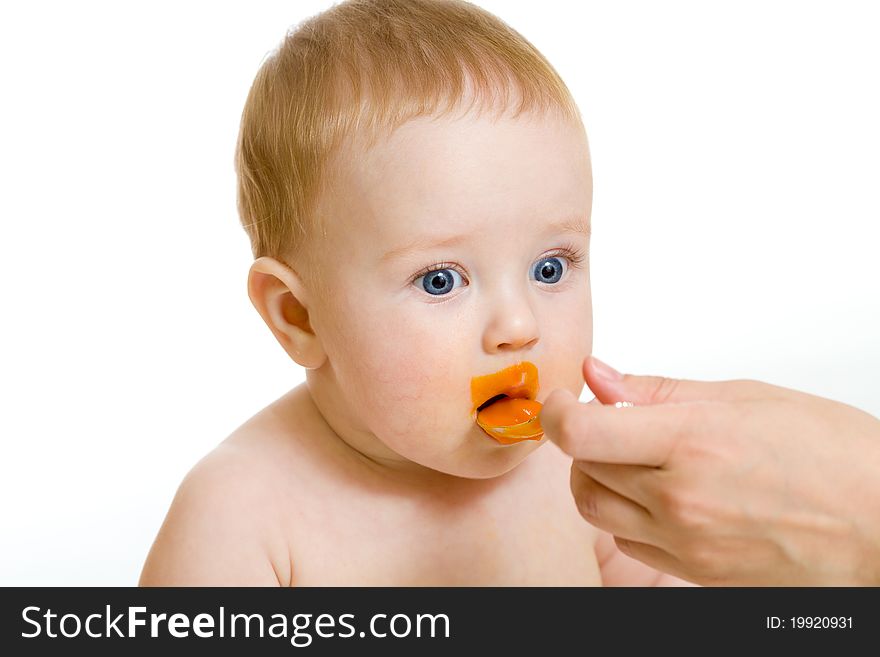 Baby boy feeding isolated on white. Baby boy feeding isolated on white