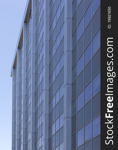 Perspective of a glass facade of a large modern office building. Perspective of a glass facade of a large modern office building