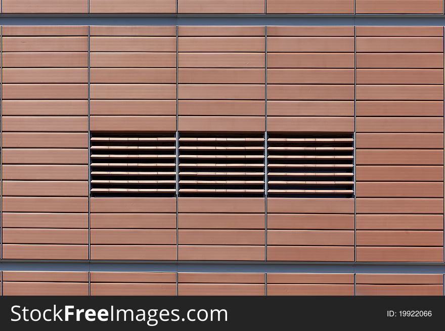 Front view of a symmetrical and evenly ordered wall texture. Front view of a symmetrical and evenly ordered wall texture