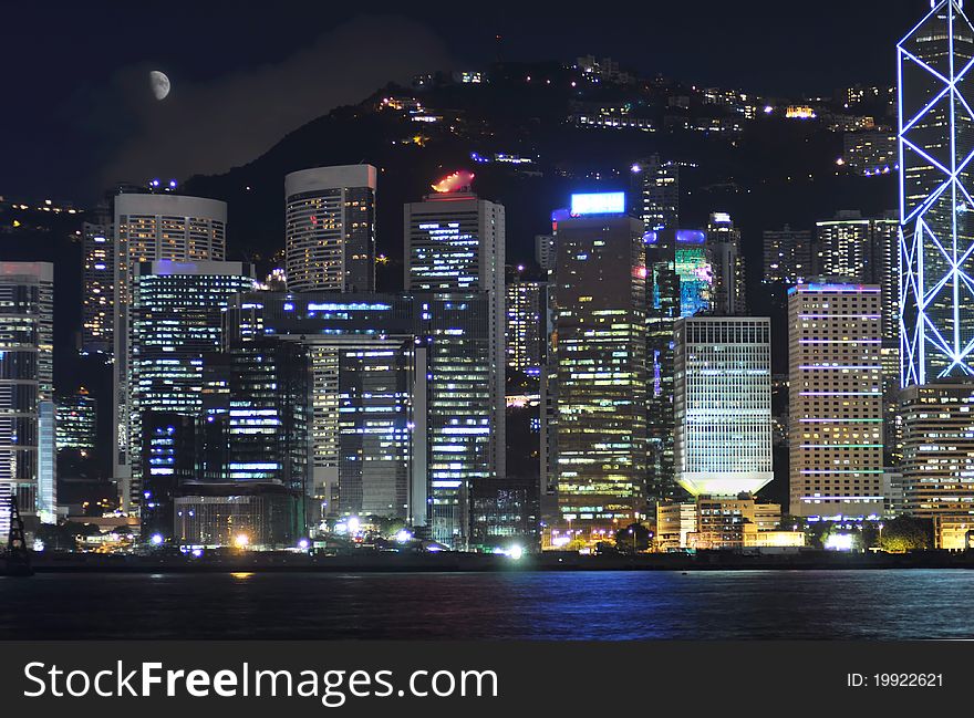 The prosperous Victoria Habor at night,the beautiful business and commercial center by the sea under moon,Hongkong,China.