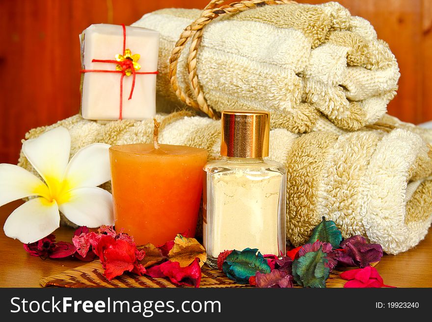 Spa products with flowers and towel