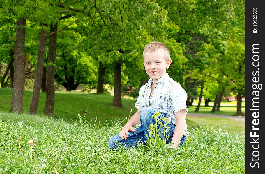 Portrait of a happy boy outdoor in a park
