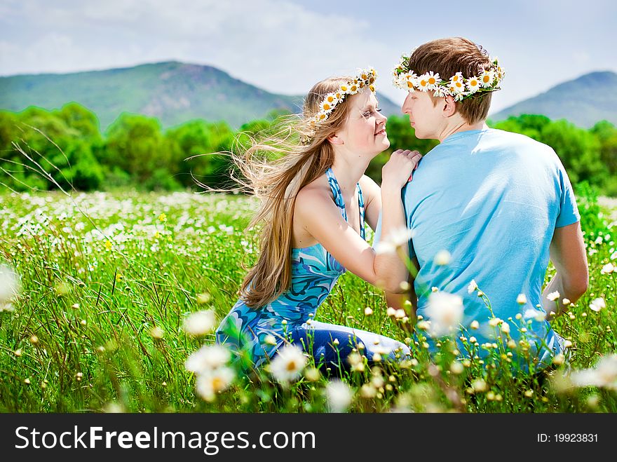 Pretty young couple in the fields