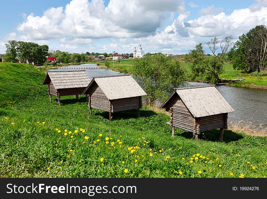 Wooden houses at a river bank.