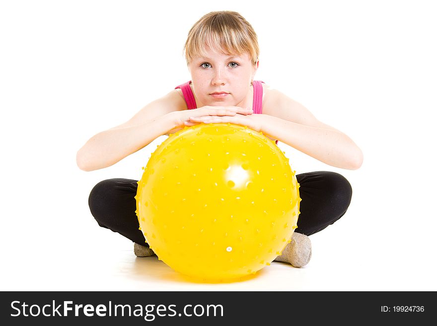 Teenager with a ball on a white background.
