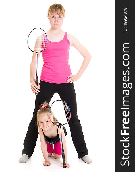 Girls with a rackets on a white background.