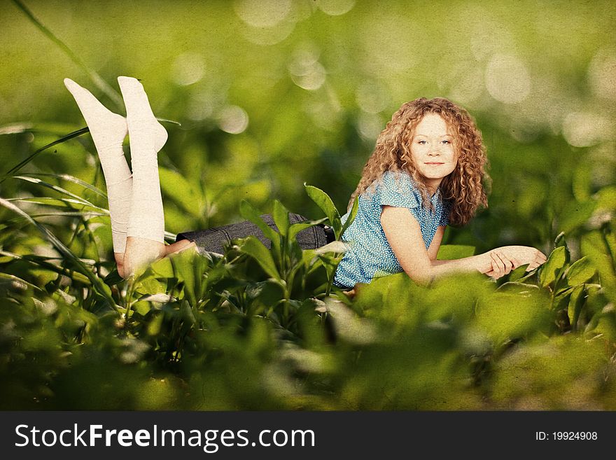 Beauty woman in a green grass