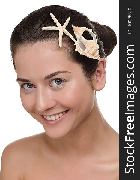 Beautiful woman with seashell and starfish in her hairs. Over white background. Beautiful woman with seashell and starfish in her hairs. Over white background