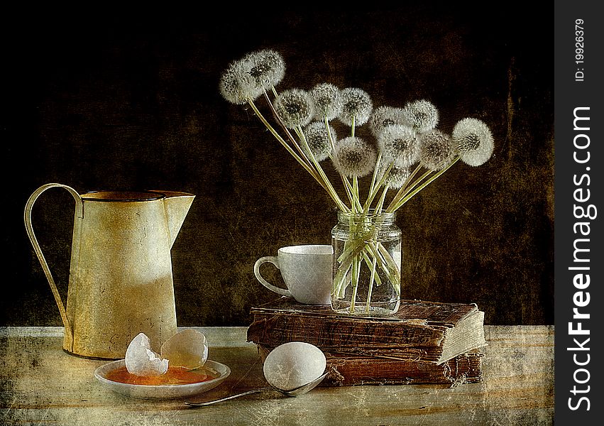 Dandelions and eggs on a table