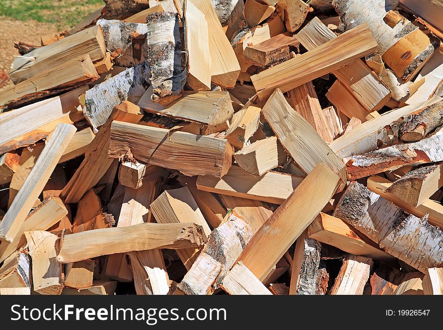 Dry wood in a big pile. Dry wood in a big pile