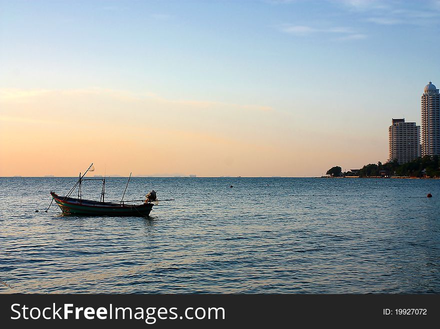 Fisherman boat with a sunset