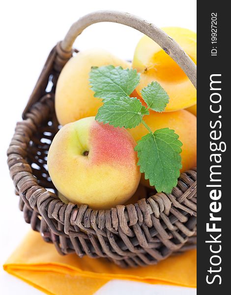 Fresh apricots in a basket closeup