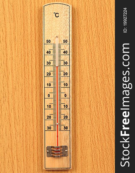 Temperature meter  from the wood   be locate on wood ground. Temperature meter  from the wood   be locate on wood ground