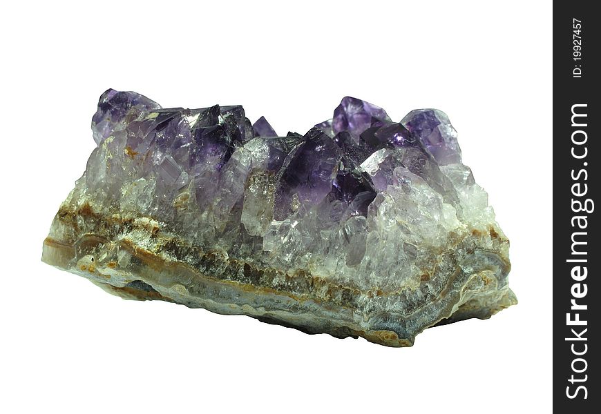 Broken piece of purple amethyst quartz on a white background