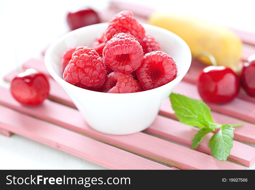 Fresh fruits raspberries cherries and banana