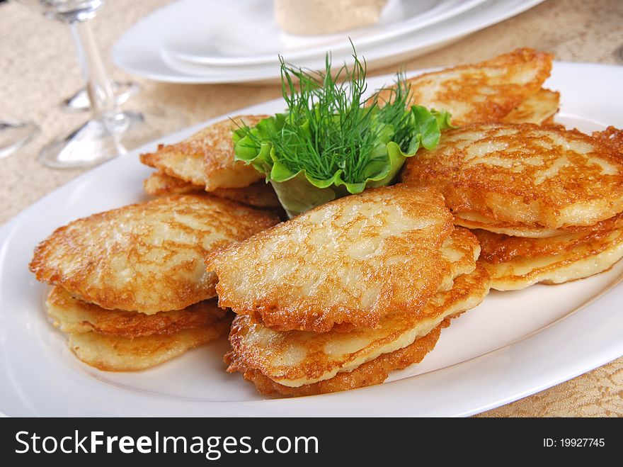 Pancakes on white plate. Restaurant