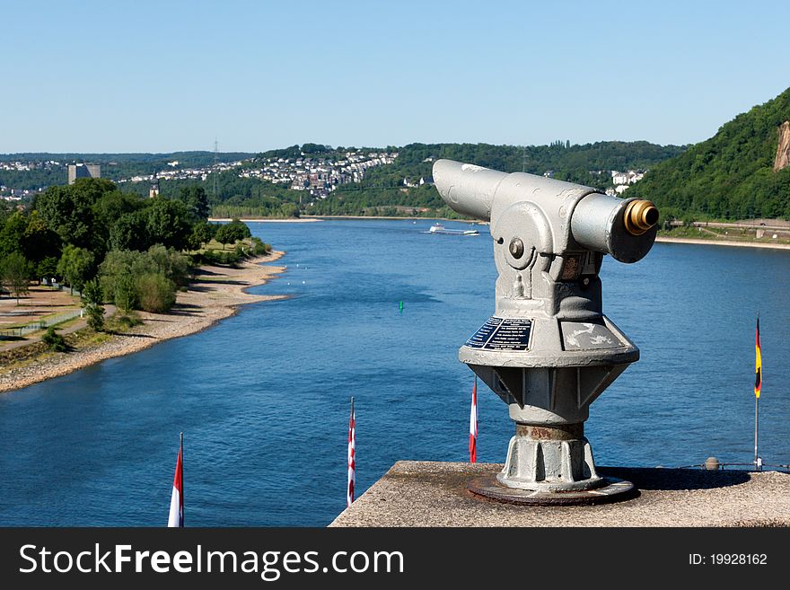 A telescope on top of an observation point at one of the most famous and scenic parts of the Rhine, the confluence with the Mosel River at Koblenz known as the German Corner (Deutsches Eck). A telescope on top of an observation point at one of the most famous and scenic parts of the Rhine, the confluence with the Mosel River at Koblenz known as the German Corner (Deutsches Eck)