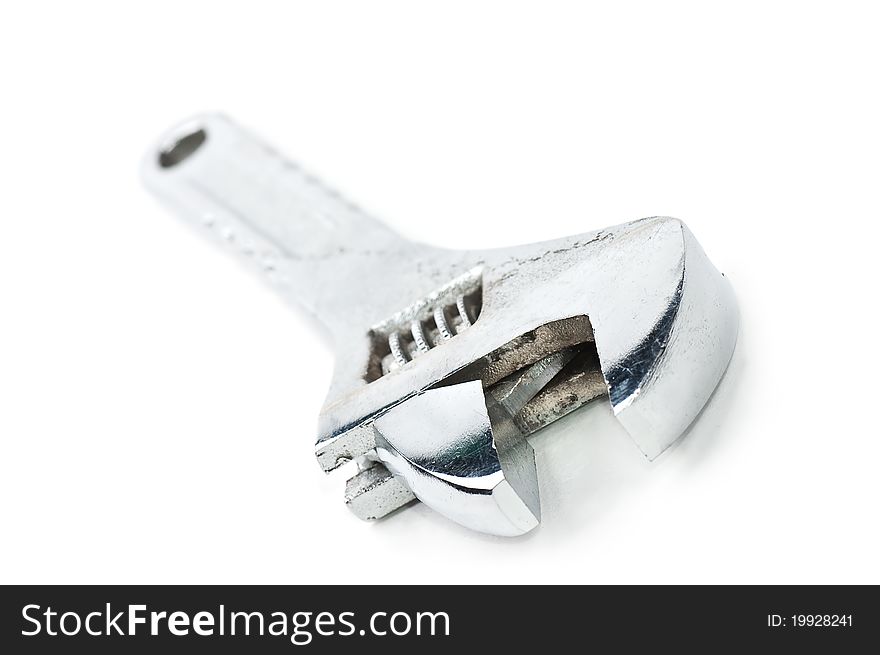 Steel wrench on a white background close up with the dim handle