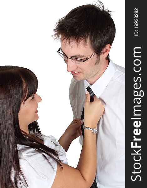 Lady helping man with necktie on a white background