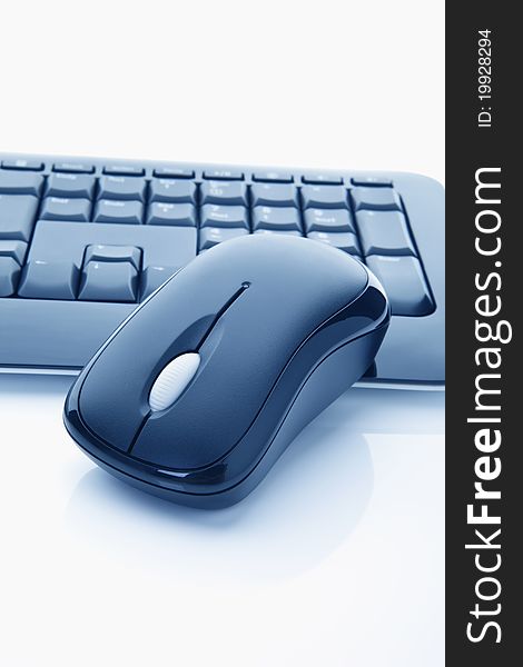 Close-up of a keyboard and a mouse on white background. Close-up of a keyboard and a mouse on white background