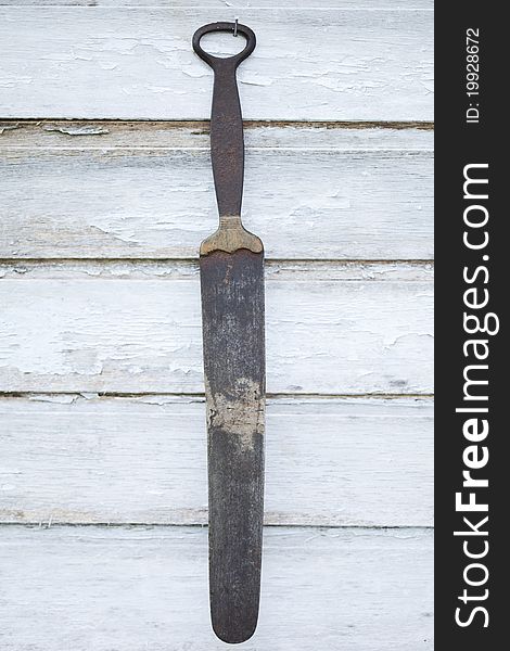 An old knife grinder on wooden underground