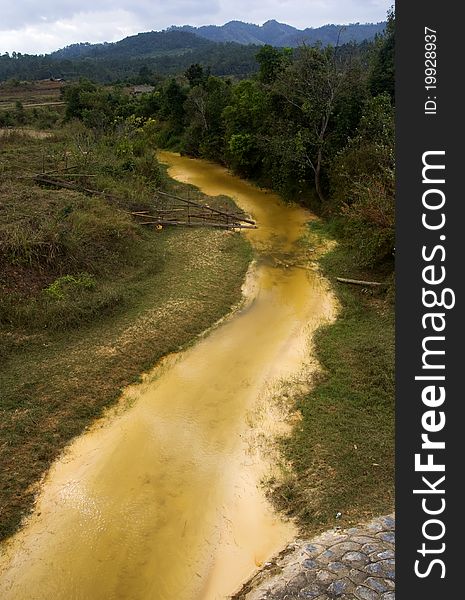 A stream runs in Laos and its color is like gold. A stream runs in Laos and its color is like gold