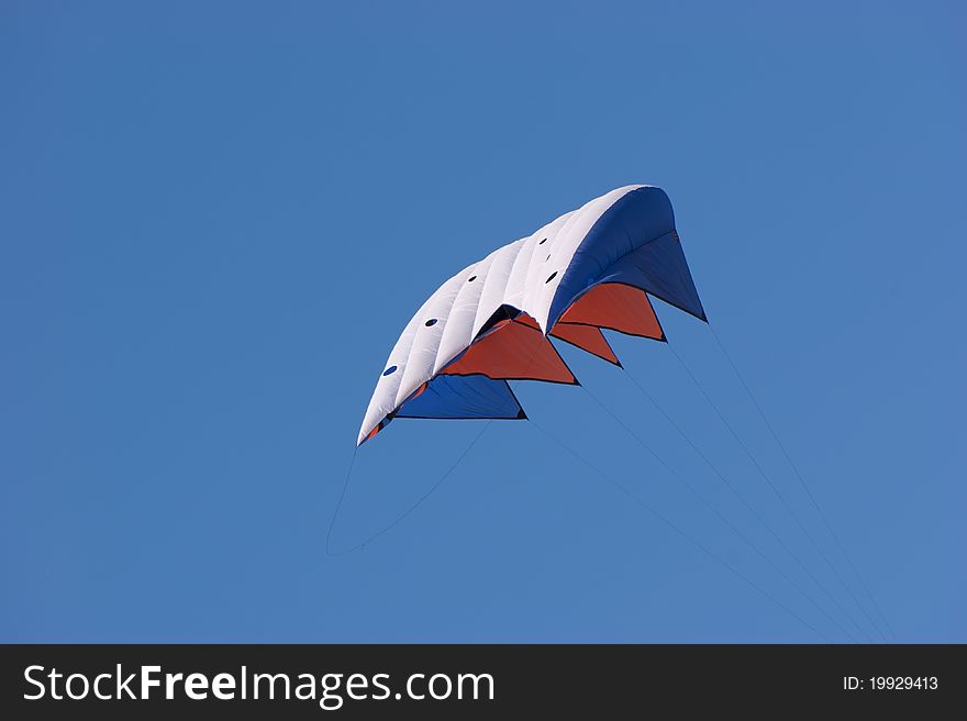 Kite against a vivid blue sky with copyspace