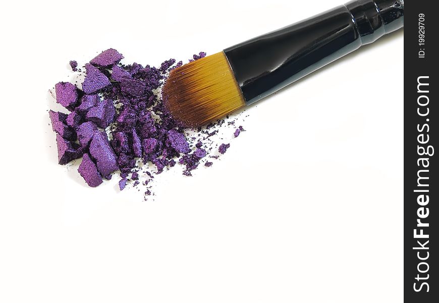 Make-up brush with colorful crushed eyeshadows. Make-up brush with colorful crushed eyeshadows