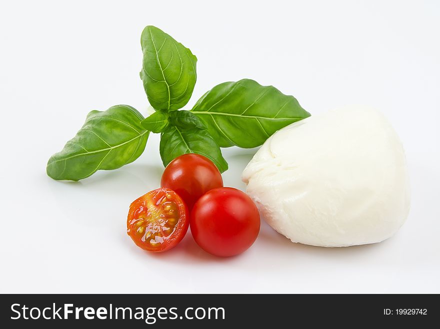 Studio shot of cherry tomato, mozzarella and bazil. Studio shot of cherry tomato, mozzarella and bazil