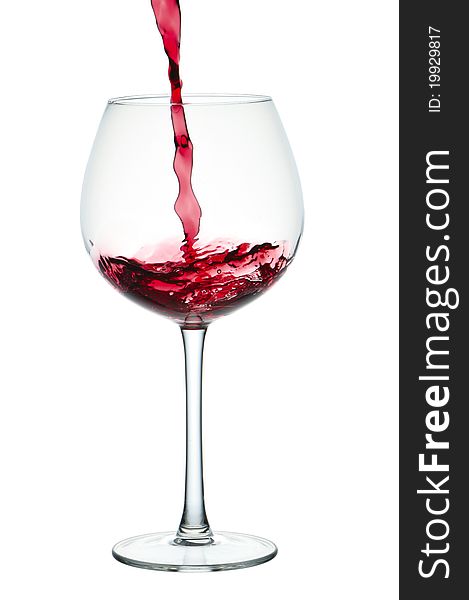 Stream Of Red Wine Falling In Glass