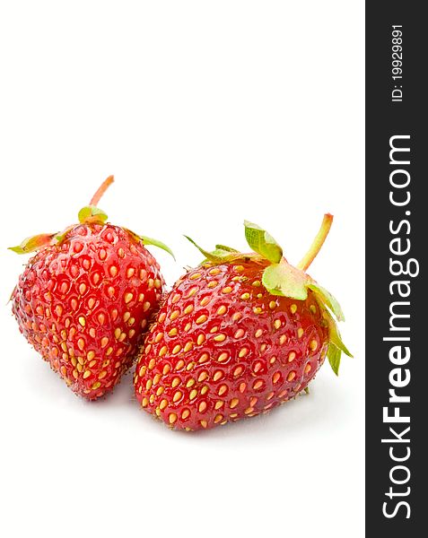 Two strawberries on a white background isolated. Two strawberries on a white background isolated