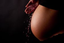 Pregnant Belly With Falling Candy Royalty Free Stock Images Pregnant Belly With Falling Candy Royalty Free Stock Images