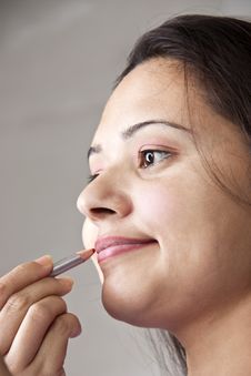 Lip Care By Young Indian Women Stock Photo