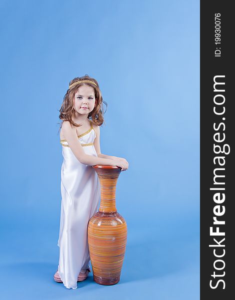 Beautiful girl in the dress of the goddess is about the vase
