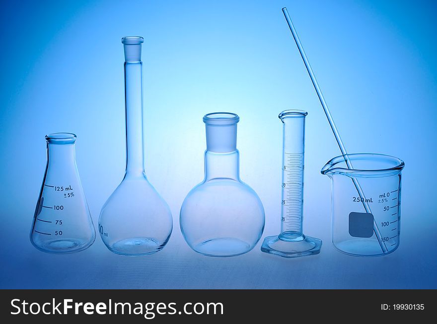 Laboratory glass on a blue background