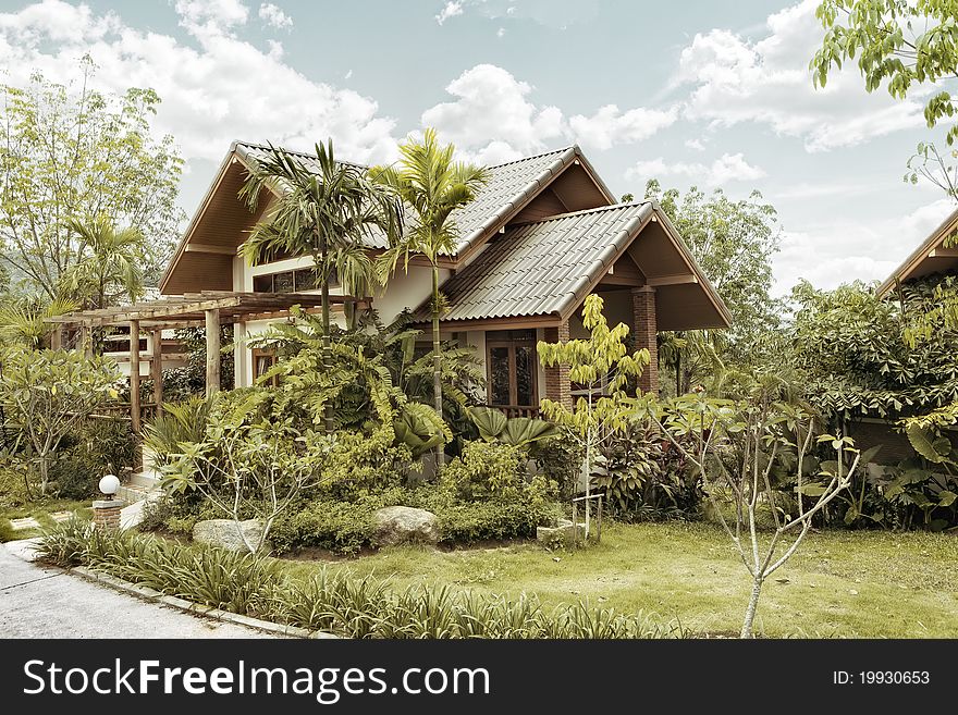 View of nice stylish summer villa in tropic environment. View of nice stylish summer villa in tropic environment