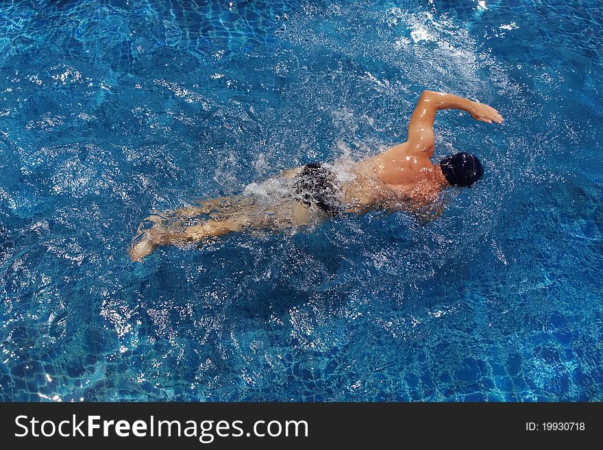 Portrait of young man swimming in pool. Portrait of young man swimming in pool