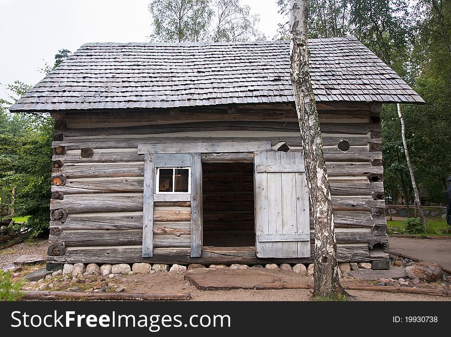 Small wooden hut in the forest.