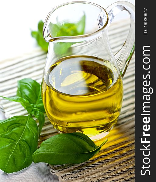 Closeup of olive oil in a glass jug