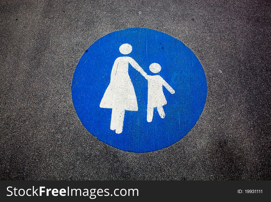 Pedestrian sign painted on a road