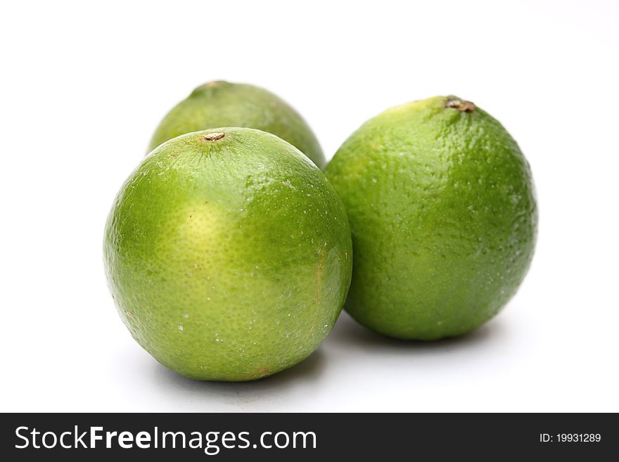 Fresh green limes isolated on white background. Fresh green limes isolated on white background