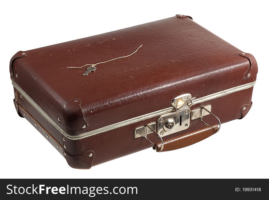 Old scratched suitcase isolated with key