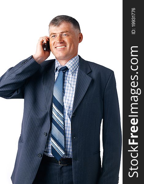 Smiling mature businessman speaking on the phone on the white background. Smiling mature businessman speaking on the phone on the white background.