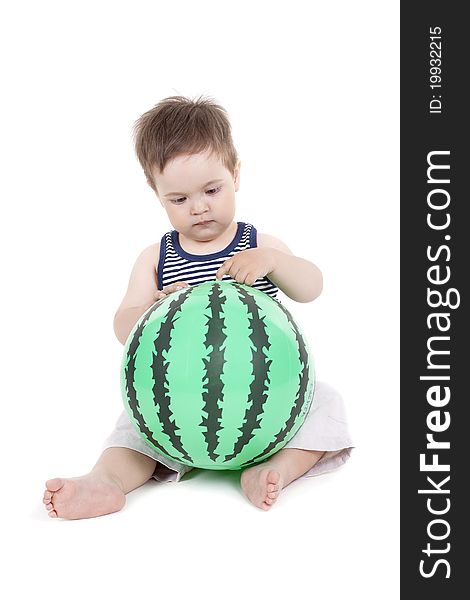 Little boy holding a ball like a watermelon on a white background. Little boy holding a ball like a watermelon on a white background