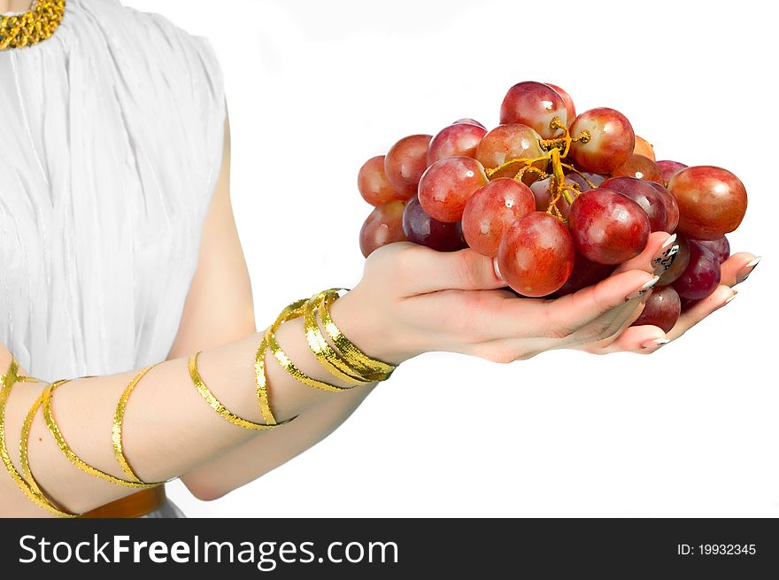 Bunch of grapes in the hands of a young woman