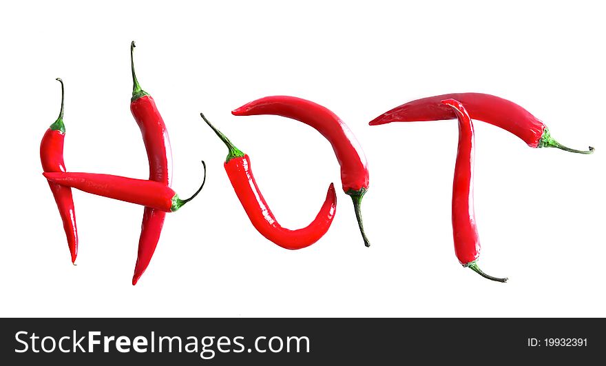 Red chilli peppers in word hot on white. Red chilli peppers in word hot on white