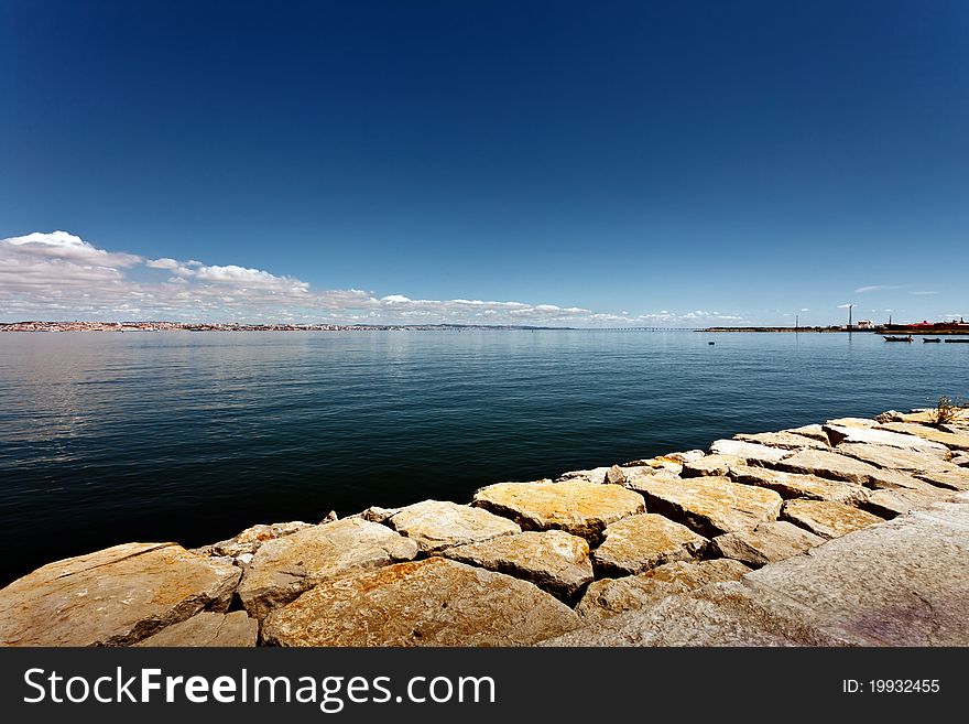 Tejo river with the city of Lisbon in the background. Tejo river with the city of Lisbon in the background.